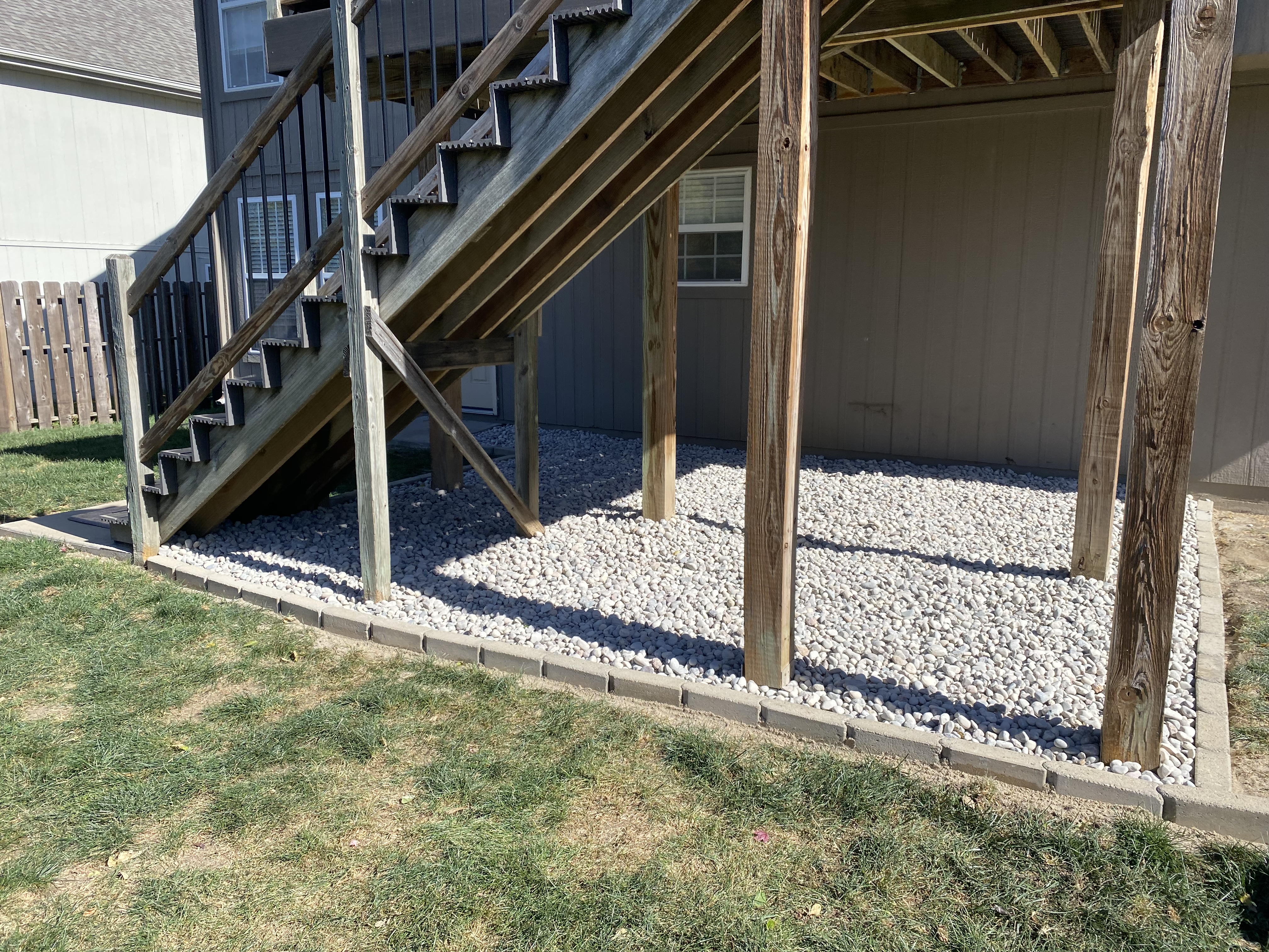 Under deck rock area after